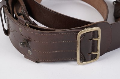 Lot 115 - A collection of ‘Sam Browne’ belts; and two Pipers black plastic Baldricks