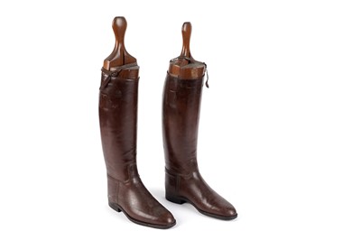 Lot 107 - A pair of brown riding boots with metal hooks