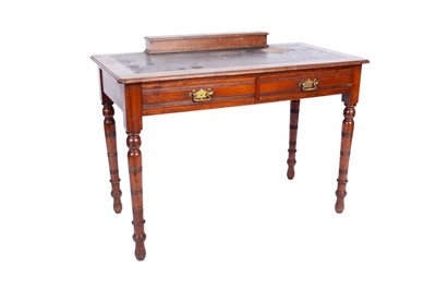 Lot 637 - An Edwardian mahogany two-drawer writing table