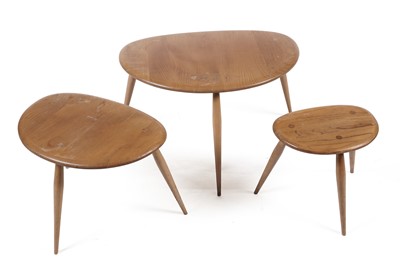 Lot 779 - An Ercol model 354 ‘Pebble’ nest of three elm-topped tables