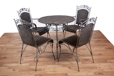 Lot 132 - A modern wrought metal and wicker garden table and four chairs