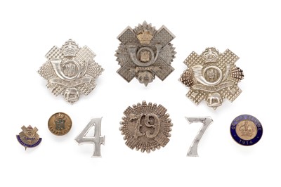 Lot 132 - A selection of Highland Light Infantry interest badges including a rare plastic example of 1940