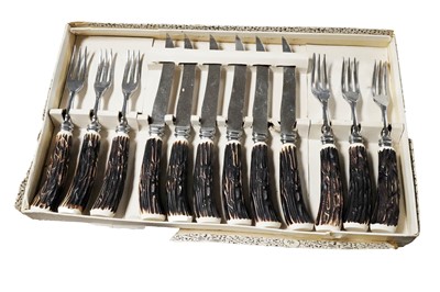 Lot 274 - A set of German steak knives and forks; and a Jublin Solingen carving set