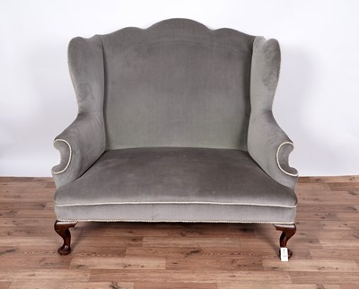 Lot 110 - A late 19th Century wingback sofa