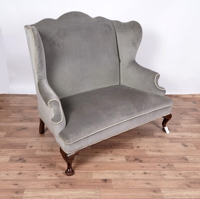 Lot 110 - A late 19th Century wingback sofa