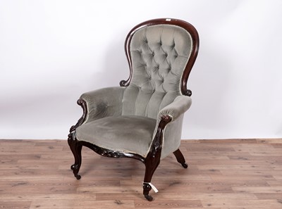 Lot 138 - A Victorian carved mahogany balloon and button back armchair
