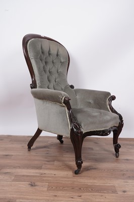 Lot 138 - A Victorian carved mahogany balloon and button back armchair