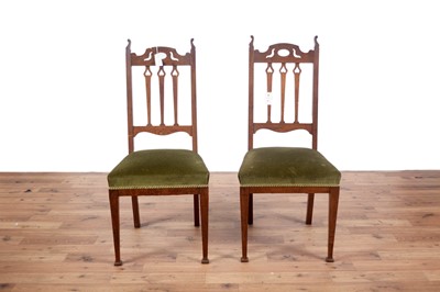 Lot 97 - A pair of early 20th Century oak arts and crafts chairs