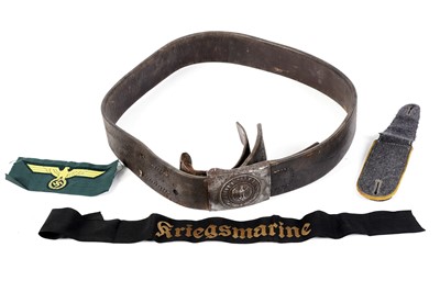 Lot 212 - A German Second World War period leather belt and buckle; and other items