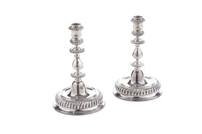 Lot 5 - A pair of Elizabeth II cast silver candlesticks