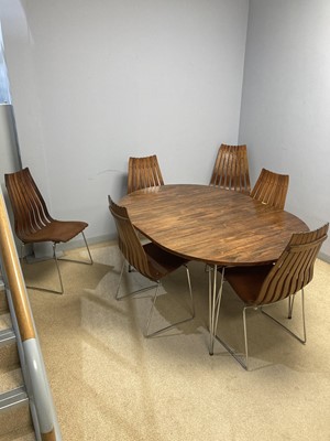 Lot 781 - A Hans Brattrud dining table; and six Hans Brattrud 'Scandia' chairs