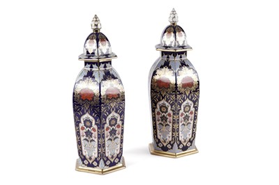 Lot 310 - A pair of Lyton Porcelain 'Hamilton Imari' pattern hexagonal jars and covers