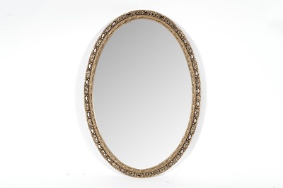 Lot 158 - A circular gold painted mirror