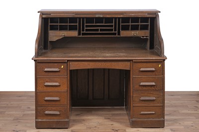 Lot 142 - An early 20th Century oak rolltop desk