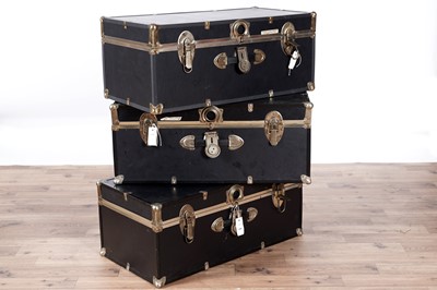 Lot 149 - Three similar black leatherette brass mounted steamer trunks