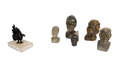 Lot 408 - A collection of carved soapstone busts; and a bronze chicken