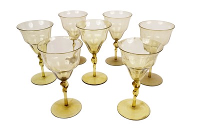 Lot 417 - A part set of olive-green glasses, by Philip Speakman Webb for James Powell and Sons