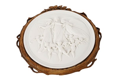 Lot 340 - A decorative ceramic wall plaque depicting three angels surrounded by cherubs