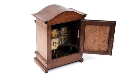 Lot 213 - An early 20th Century German carved oak mantel clock
