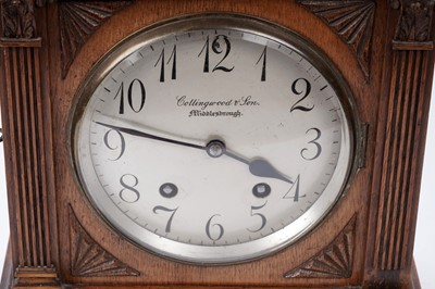 Lot 213 - An early 20th Century German carved oak mantel clock