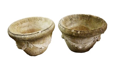 Lot 492 - A pair of stone composite garden planters of ﻿tapered circular form with garland decoration