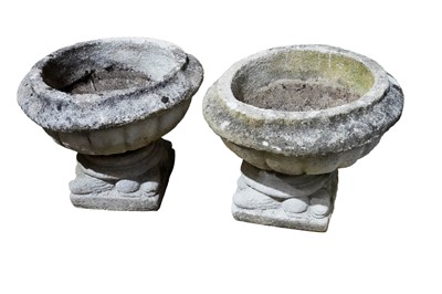 Lot 498 - ﻿A pair of classical style composite stone garden urns