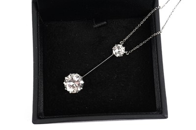 Lot 709 - A two stone diamond pendant