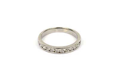 Lot 729 - A diamond half hoop eternity ring