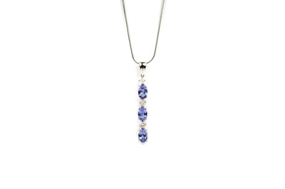 Lot 673 - A tanzanite and diamond drop pendant necklace