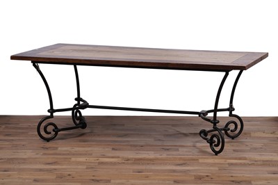 Lot 110 - A modern oak and wrought metal dining table