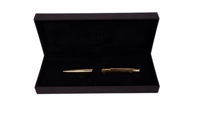 Lot 968 - A Dunhill gilt metal ballpoint pen, with its case and original box