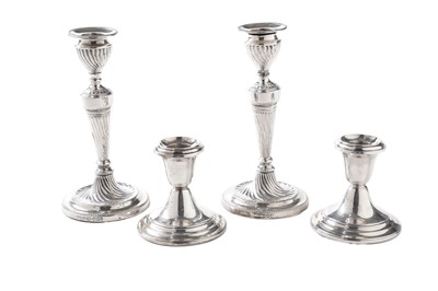 Lot 150 - Two pairs of Victorian and later silver candlesticks