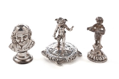 Lot 377 - Two silver seals; and a miniature silver putto figure