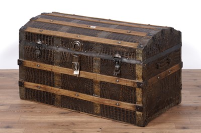 Lot 90 - An early 20th Century pine and faux crocodile skin metal bound 'treasure trunk'