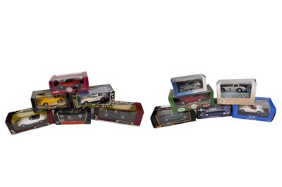 Lot 142 - A collection of diecast model cars, primarily scale 1:18 including: Corgi and Bburago