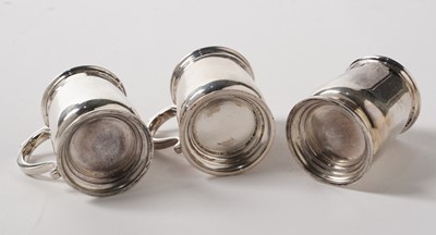 Lot 160 - A George V cased set of six silver tot cups in the form of miniature mugs