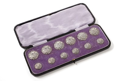 Lot 385 - A late Victorian cased set of twelve silver buttons