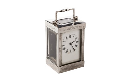 Lot 21 - An Elizabeth II miniature silver mounted carriage timepiece