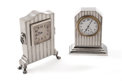 Lot 394 - An art deco silver mounted timepiece; and a similar silver mounted timepiece