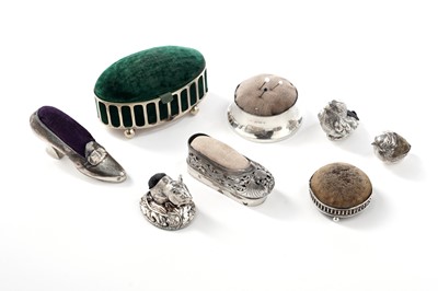 Lot 372 - Pin cushions including: an American silver shoe pin cushion; and seven others