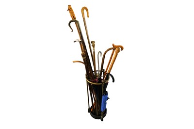 Lot 753 - A selection of 20th Century walking and other sticks contained in a 20th Century brass stick stand