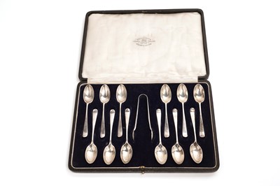 Lot 254 - A set of twelve silver teaspoons and tongs