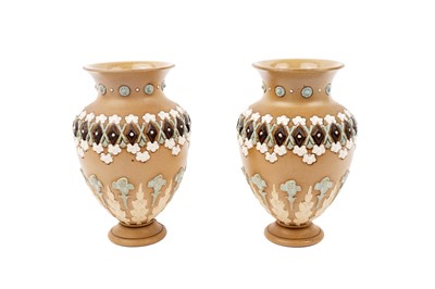 Lot 422 - Hayward E Violet for Royal Doulton: a pair of early 20th Century Lambeth stoneware vases