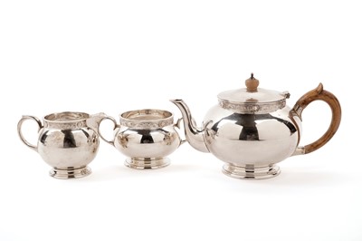 Lot 342 - A Lindisfarne silver three-piece tea service by Reid & Sons