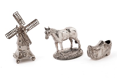 Lot 352 - A silver sculpture of a horse; an articulated silver windmill; and another