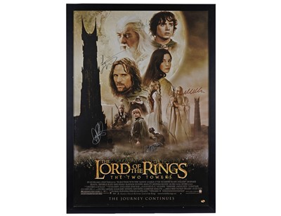 Lot 294 - Two signed Lord of the Rings film posters; and a Lord of the Rings 'Middle Earth' map poster