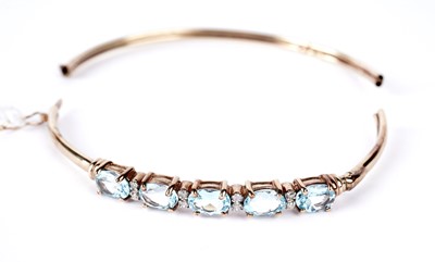 Lot 177 - A topaz and diamond bangle