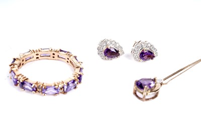 Lot 189 - A pair of amethyst & diamond earrings and pendant; and a purple stone ring