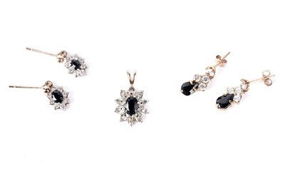 Lot 174 - A sapphire and diamond cluster pendant; and two pairs of earrings