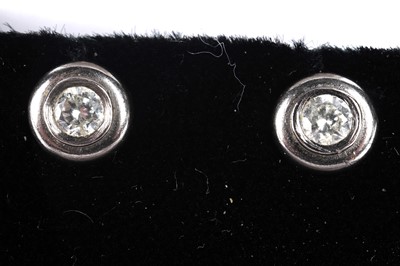 Lot 157 - A pair of diamond stud earrings